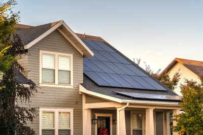 Home purchased using an energy-efficient mortgage features solar panels on the roof.