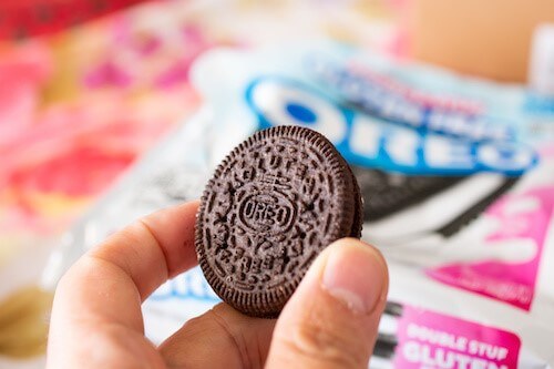 A homeowner holding an Oreo