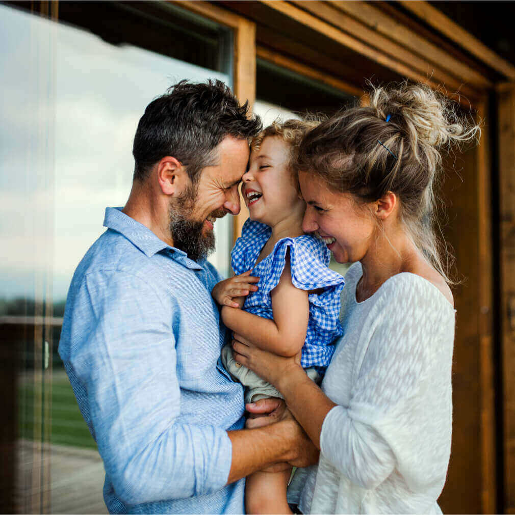 CrossCountry Mortgage couple holding their child photo.