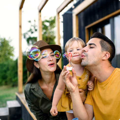 A family blowing bubbles.
