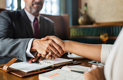Loan officer and borrower shaking hands