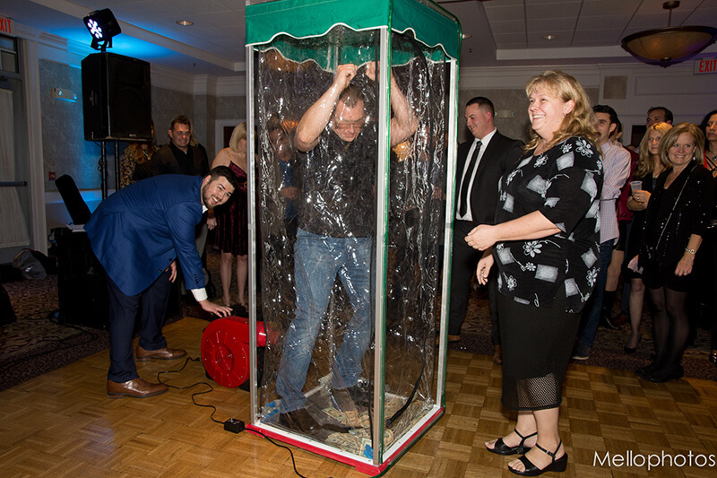 A client scrambling to collect money in the money grabbing machine