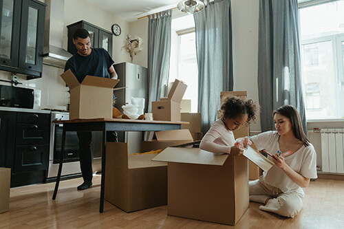 A family unpacking in their new home