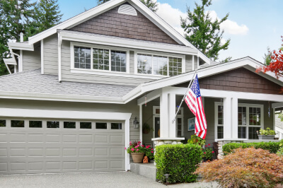 Exterior of a home that qualified for a VA loan displays the American flag.