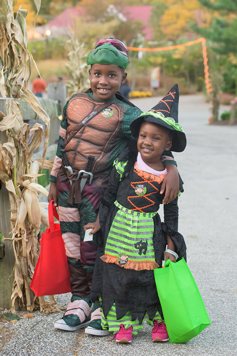 Two boys excited to trick or treat through the Cleveland Metroparks Zoo