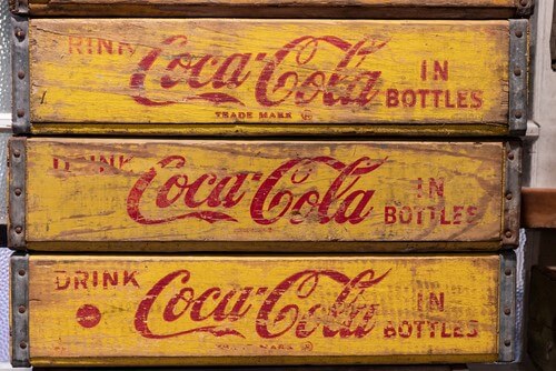 Three boxes of Coca-Cola bottles