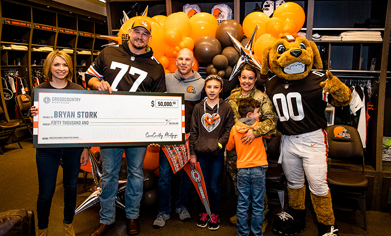 The Stork family receiving the grand prize from CCM